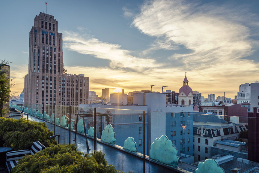 View of a city from a rooftop deck