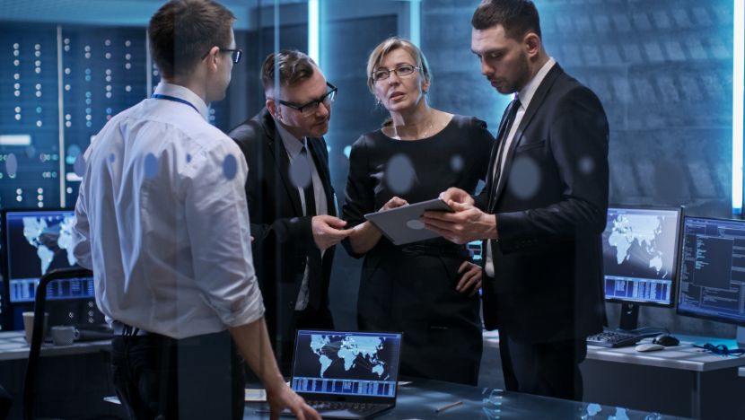 Team discussing over a tablet